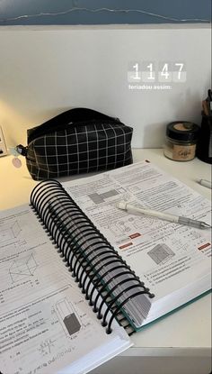 an open notebook sitting on top of a desk