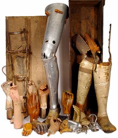 an assortment of old items including boots and other things