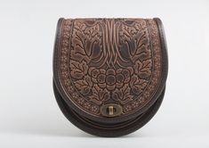 "Brown crossbody bag, round leather bag, brown leather purse, chocolate bag womens, crossbody bag, messenger bag, embossed leather Model \"Guelder rose\" Unique handmade bag made of premium 4 mm genuine calf leather. Made using rare technology of hot tooling. Super comfortable, durable and functional. Has one big compartment, one internal zip-pocket and one button pocket, e.g. for cell phone or keys. 22x20x8 cm (8.3x7.9х3.1 in) Strap length 140 cm (55 in) Please note! Since each item in my shop Brown Round Case Shoulder Bag For Everyday, Brown Round Case Shoulder Bag, Brown Embossed Satchel Shoulder Bag, Brown Embossed Crossbody Shoulder Bag, Chocolate Bag, Unique Backpacks, Brown Leather Purse, Embossed Bag, Tooled Leather Purse