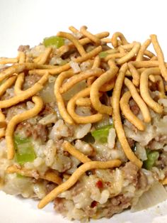 the food is covered with noodles and other toppings