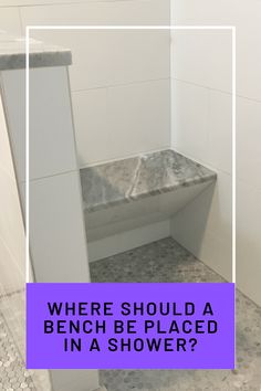 a white tiled bathroom with the words where should a bench be placed in a shower?