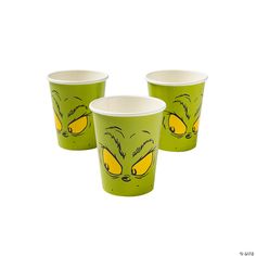 three green cups with yellow faces on them