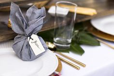 a place setting with silverware and napkins