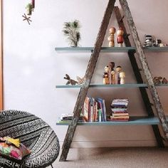 a room with a ladder, bookshelf and other items on the shelves in it