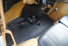 the interior of a car with black leather seats