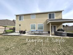 a house with a hot tub in the back yard and an awning over it that says keepin't simple