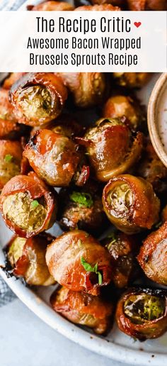 bacon wrapped brussel sprouts on a white plate with a small bowl of sauce