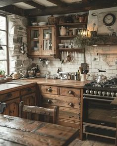 an old fashioned kitchen with wooden cabinets and wood table in the center, surrounded by brick walls