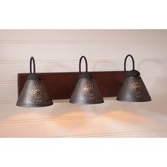 three light fixture mounted on the wall