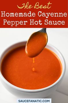 the best homemade cayenme pepper hot sauce in a white bowl with a spoon