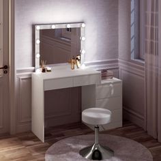 a white vanity table with lights on it and a stool in front of the mirror