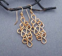 Inspired by ancient lace and filigree designs, these romantic dangle earrings are handmade entirely in solid bronze. I loop and curl the bronze into a very feminine and ethereal pattern. The pale rose gold / champagne blush color of the bronze is right-on-trend and so flattering to every skin tone. Ear wires are handcrafted in bronze. These solid bronze earrings are a romantic 8th or 19th wedding anniversary gift. (Bronze is the traditional gift for couples celebrating 8 or 19 years of marriage) Ethereal Pattern, Chainmaille Jewelry Patterns, 19th Anniversary Gifts, 19th Wedding Anniversary, 19th Anniversary, Chainmaille Jewelry, Chain Maille Jewelry, Bronze Earrings, Anniversary Gift For Wife