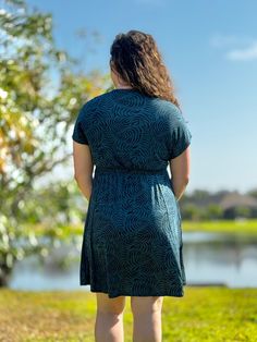 Experience comfort and style with our Boardwalk Dress. Made from super soft, lightweight stretch fabric, this dress features a relaxed A-line style with side pockets and an open v-neck with elastic waistband. With an above the knee length and machine washable material, it's perfect for any occasion. Katie is wearing a size large. Casual Green V-neck Dress With Surplice Neckline, Casual Green Knee-length V-neck Dress, Casual Green V-neck Knee-length Dress, Casual A-line Mini Dress With Pleated Waist, V-neck Rayon Dress With Elastic Waistband, Casual V-neck Dress With Surplice Neckline, Casual V-neck Dress With Tie Waist And Short Sleeves, V-neck Dress With Gathered Waist For Day Out, Casual V-neck Midi Dress With Tie Waist