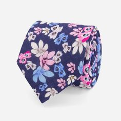 With its bold floral pattern and pops of pink and blue, this linen tie will make a stylish statement at your next destination wedding. | Men's Tie Bar: Tossed Lillies Tie - Skinny, In Navy, Linen, Floral Blue Summer Wedding Ties, Blue Floral Print Tie As Gift, Adjustable Blue Floral Print Tie, Summer Floral Print Ties, Pink Floral Print Ties For Summer, Pink Floral Print Tie For Summer, Pink Floral Print Ties For Spring, Pink Floral Print Summer Ties, Printed Linen Fabric