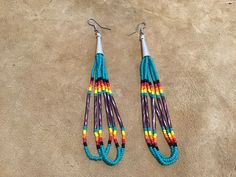 Authentic Beautiful Native American Indian Jewelry Navajo Hand Beaded Long Dangle Earrings. Great for a gift❤️ Handcrafted by Navajo Artist R. Sellers These beautiful earrings are 5" in length and 1" in width. Southwestern Teardrop Beaded Earrings, Southwestern Multicolor Nickel-free Beaded Earrings, Southwestern Style Multicolor Nickel-free Beaded Earrings, Southwestern Style Beaded Earrings For Festival, Southwestern Style Brown Beaded Earrings, Adjustable Southwestern Beaded Earrings, Adjustable Hand-strung Southwestern Beaded Earrings, Southwestern Multicolor Beaded Earrings, Native American Beadwork Patterns