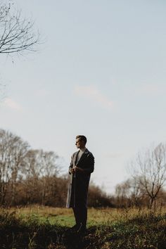 a man standing in the middle of a field