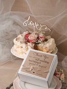 a wedding cake with a sign on top