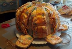 a large tortoise shell sitting on top of a table covered in plastic wrap