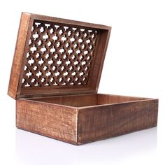 an open wooden box on a white surface with the lid closed and latticed design