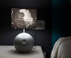 THAT'S NO MOON This Star Wars Death Star Touch Lamp is most impressive. Specially crafted with Empire-approved materials, this desk lamp features a 3D sculpted base of the iconic battle station and a black lamp shade. The printed shade features fan-favorite ships from the Star Wars galaxy, including the Death Star, TIE Fighters, X-Wings, and the Millennium Falcon. Measuring 14 inches tall and 8 inches in diameter, this collectible desk lamp is the perfect room decor accent piece for Star Wars fans of all ages. Powered by USB (cable included), this desk lamp features 3 different touch-control modes: shade only, base only, the shade and base together. Simply tap the Concave Dish Composite Beam Superlaser to make this Death Star Touch Lamp fully-operational. Star Wars Lamp, Star 3d, Star Wars Decor, Black Lampshade, Star Lamp, Touch Lamp, Star Wars Collection, Led Desk Lamp, Lamp Led