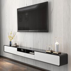 a flat screen tv mounted to the side of a wall