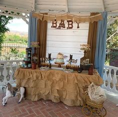 a baby shower is set up outside on the patio