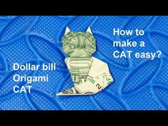 dollar bill origami cat on blue background with words how to make a cat easy