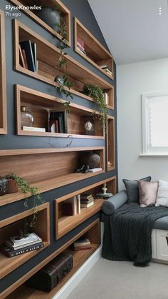 a living room filled with lots of wooden shelves