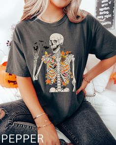 Skeleton Shirt, Skeleton Leaves crew neck, Halloween Skeleton Shirt, Fall Leaves Skeleton t-shirt, Spooky Season Shirt, Skull Leaves Tee, Comfort Color Oversized Shirt Comfort Colors introduces its garment-dyed t-shirt; a fully customizable tee made 100% with ring-spun cotton. The soft-washed, garment-dyed fabric brings extra coziness to your wardrobe while the relaxed fit makes it an excellent daily choice. The double-needle stitching throughout the tee makes it highly durable while the lack of Spooky Skull Print Top For Fall, Spooky Skull Print Fall Top, Spooky Skull Print Tops For Fall, Casual Skull T-shirt For Fall, Fall Skull Print Crew Neck Top, Fall Skull Print Cotton T-shirt, Grunge Skull Tops For Fall, Fall Cotton T-shirt With Skull Print, Casual Skull Print T-shirt For Halloween