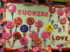 a bulletin board with lots of stickers on it that says suckerrs for love