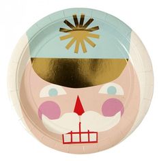 a paper plate with an image of a clown's face on the front and sides