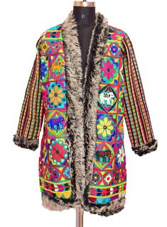 "Item Description Banjara White & Black Outlet Faux Fur Music Festival Look Open Jacket,Gujarat Embroidered Work Jacket, Tribal Coat Tribal banjara vintage handmade fabric created by the ancient nomadic tribes of india; upcycled into a beautiful mirror embellished long coat. Measurements: Jacket Size Type: Regular Jacket Size (Women's): M Decade: 1990s Open Jacket Jacket Bust/Chest Size - \"48\" Inches Jacket Length - \"36\" Inches Jacket Shoulder to Shoulder: Size - \"17\" Inches Jacket Sho Fitted Multicolor Embroidered Outerwear For Festivals, Fall Festival Outerwear With Boho Collar, Multicolor Embroidered Winter Outerwear, Embroidered Multicolor Winter Outerwear, Winter Embroidered Multicolor Outerwear, Winter Multicolor Embroidered Outerwear, Fitted Winter Outerwear With Multicolor Embroidery, Fitted Multicolor Embroidered Winter Outerwear, Fitted Multicolor Bohemian Outerwear