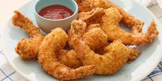 fried shrimp rings with dipping sauce on a plate