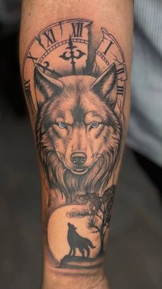 a man's leg with a wolf and clock tattoo on the side of it