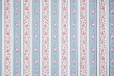 a blue and white striped wallpaper with pink flowers