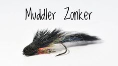 a black and orange fly with the words muddler zinker on it