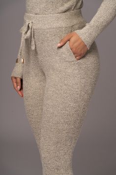 Slip into something cozy with our Gray Sedona Knit Pant Set, a must have for your winter wardrobe. This luxurious set features a long sleeve top with an asymmetric neckline and matching jogger pants with side pockets and an elastic waistband. Made from soft, quality knit fabric for ultimate comfort and style. Sold as set. Materials: 70% Acrylic 27% Nylon 3% SpandexLength: Top (full) 19 in. (sleeve) 18.5 in. Bottoms (inseam) 26 in. (waist) 27 in. Product Origin: ImportedWashing Instructions: Hand Asymmetric Neckline, Knit Pants, Pant Set, Sedona, Winter Wardrobe, Jogger Pants, Long Sleeve Top, Knit Fabric, Pants Set