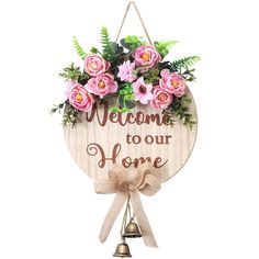 a wooden sign that says welcome to our home with pink flowers and greenery on it