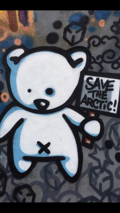 a white teddy bear painted on the side of a wall with graffiti writing save the arctic