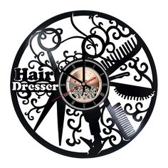 a wall clock with scissors and combs on the face that says hairdresser