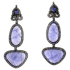 Sauve Slice Tanzanite Earrings with diamond motif on top is simple and a very attractive piece. Closure: Push Post 18k:2.24g Diamond: 2.69ct Slv: 10.46gm Tanzanite: 39.55ct Tanzanite Diamond Earrings, Tanzanite Earrings, June Birthstone Jewelry, Blue Tanzanite, Pearl Jewellery Earrings, Eye Jewelry, Fine Jewelry Gift, Fashion Jewelry Necklaces, Bohemian Jewelry