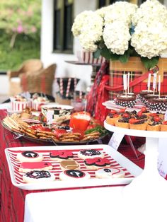 a table topped with lots of desserts and cakes