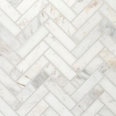 a white marble herringle tile pattern