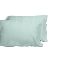 two light blue pillows sitting next to each other