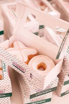 several boxes of doughnuts are stacked on top of each other