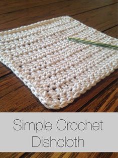 a white crocheted dishcloth with a pencil resting on it