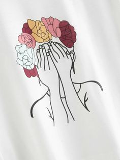 a woman with flowers in her hair wearing a white t - shirt