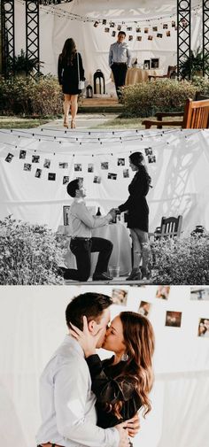 a couple kissing each other in front of a white tent with pictures hanging on it