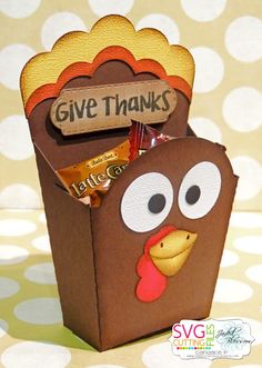 a turkey treat box filled with chocolates and candy bar wrappers for the thanksgiving give thanks