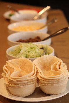 there are many different types of food on this plate, including tortillas and salads